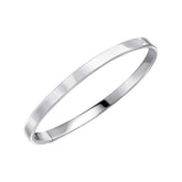 A single, wide, plain hinged bangle in polished sterling silver, shown slightly open on a white background.